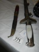 A dagger and a knife ****Condition report**** The German dagger is a reproduction