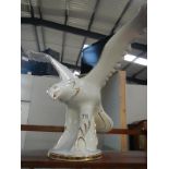 A large china figure of an eagle a/f