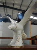 A large china figure of an eagle a/f