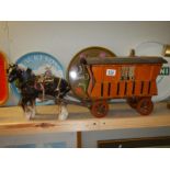 A pottery horse and gypsy carriage model