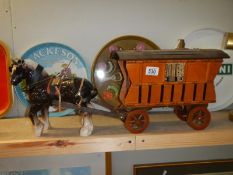 A pottery horse and gypsy carriage model