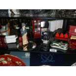 A shelf of miniatures and dolls house items