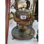 A brass kettle on stand