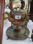 A brass kettle on stand