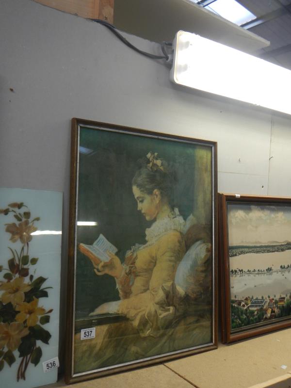 A vintage framed and glazed picture of a girl reading