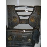 A cast iron fire place front and grate