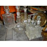 3 glass and crystal decanters and a condiment set