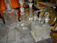 3 glass and crystal decanters and a condiment set