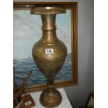 A middle eastern style brass vase