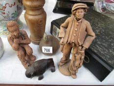 A quantity of wooden and clay figures etc