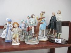 A collection of figurines including bisque and Capo di Monte