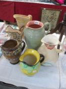 A collection of 6 pottery jugs