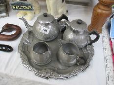 A pewter tea and coffee set on tray
