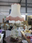 A large figural Florence Capo Di Monte lamp with shade