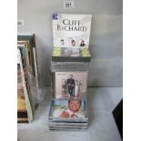 A collection of CDs including Cliff Richard