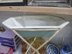 A vintage dolls bath on stand