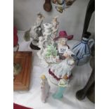 A collection of figurines including Guiseppe Armani