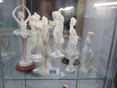 A collection of 7 figurines including classical,