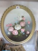 A oval gilt framed oil on board Floral Study