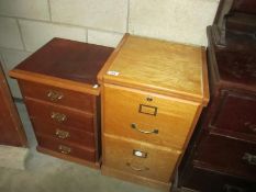 A two drawer filing cabinet and small drawer chests of drawers