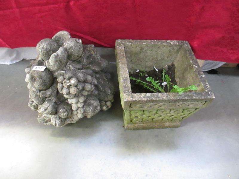 A stone garden ornament and a stone planter