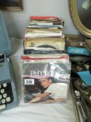 A collection of 45 rpm single records