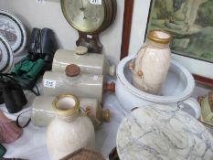 3 stoneware hot water bottles and 2 stoneware bottles and a pot