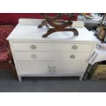 A white painted 2 drawer chest with bottom cabinet