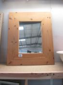 A wooden framed mirror