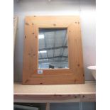 A wooden framed mirror