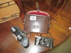 A cased Ross London set of binoculars and a Vest Pocket Kodak