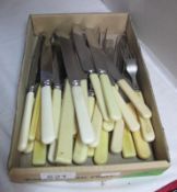 A quantity of retro plastic handled cutlery