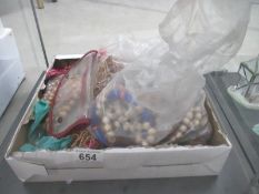 A box of costume jewellery - mainly beads