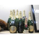 8 shop display champagne bottles including Moet and Chandon (No contents as bottles produced