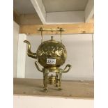 An ornate brass tea kettle on stand A/F