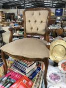 A deep buttoned upholstered bedroom chair