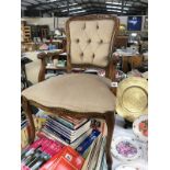 A deep buttoned upholstered bedroom chair