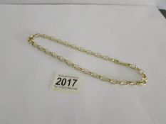 A 9ct gold neck chain, approximately 11 grams.