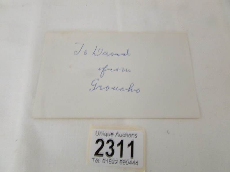 A card autographed 'Groucho' (Marx).