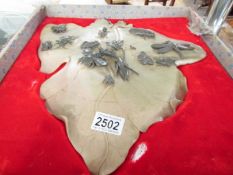 A large oriental carved soapstone leaf with carved insect decoration.