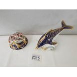 2 Royal Crown Derby paperweights being a frog and a dolphin both with gold stoppers.