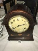 A mahogany inlaid bracket clock