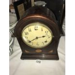 A mahogany inlaid bracket clock