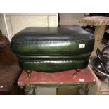 A green leather foot stool pouffe
