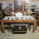 A modern teak dining table and 5 chairs.