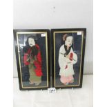 2 silk portraits depicting a Japanese man and woman.