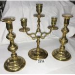 A pair of Victorian brass candlesticks & a 3 branch candle stand