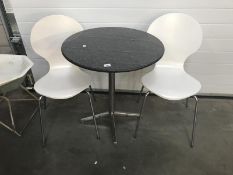 A black marble top kitchen/garden table and 2 chairs