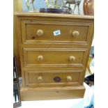 A solid pine 3 draw bedside chest of drawers