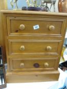 A solid pine 3 draw bedside chest of drawers